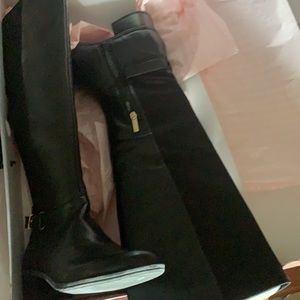 Brand new black leather boots made by Bandolino